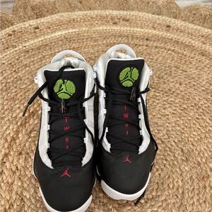 Black and White Air Jordan’s with Red and Green Accents